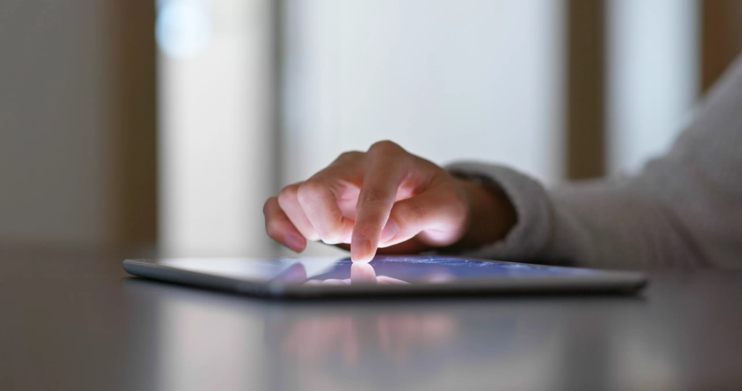 Individual interacting with tablet device