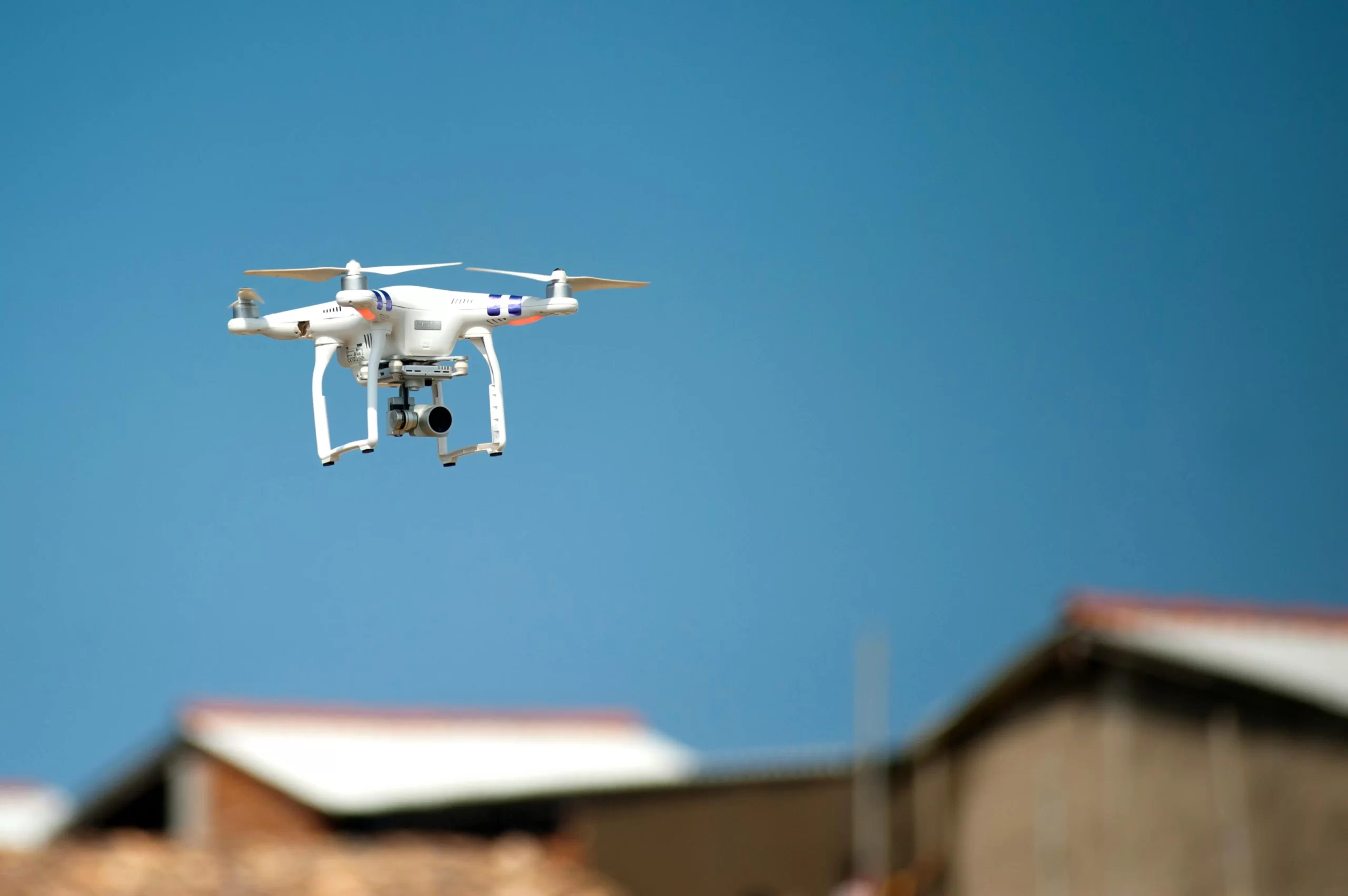 A drone flying over a group of houses